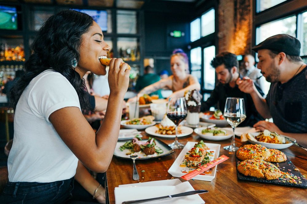a group of people eating at a restaurant